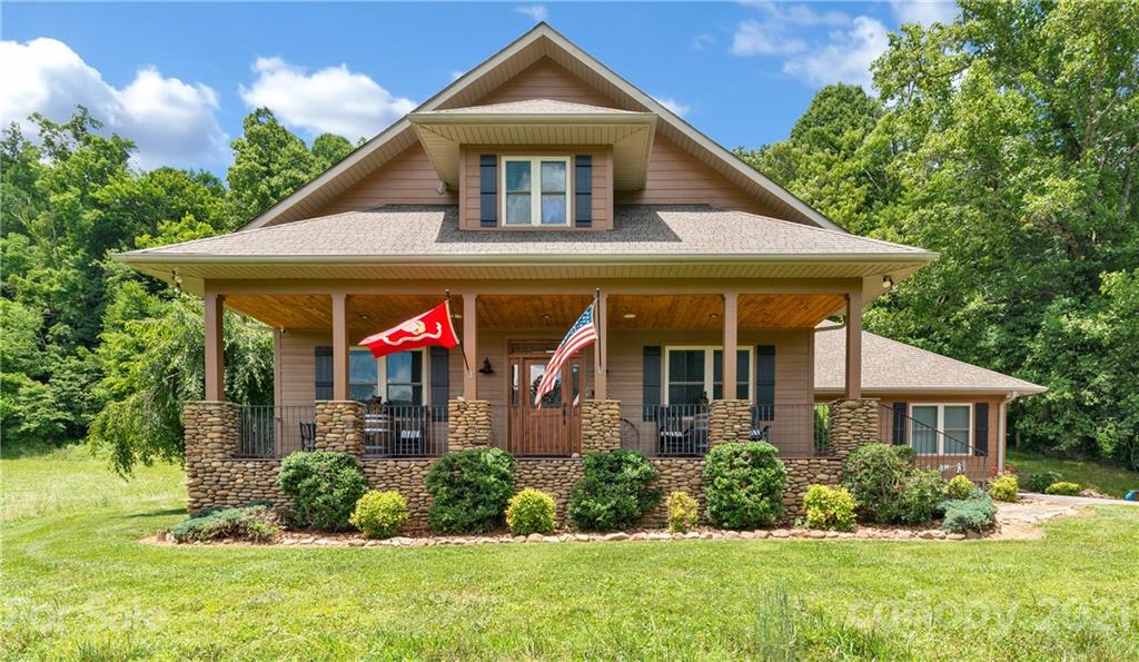 253 Benitez Way Clyde, NC 28721 - Photo 1 of 40 a front view of a house with a yard