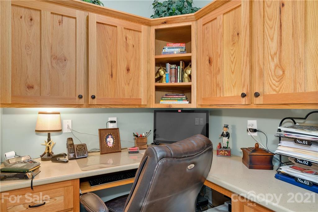 253 Benitez Way Clyde, NC 28721 - Photo 11 of 40 a work place with a desk chair and painted walls