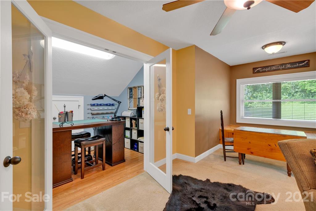 253 Benitez Way Clyde, NC 28721 - Photo 29 of 40 a bedroom with furniture and a window