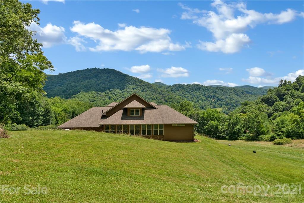 253 Benitez Way Clyde, NC 28721 - Photo 35 of 40 a front view of a house with a yard