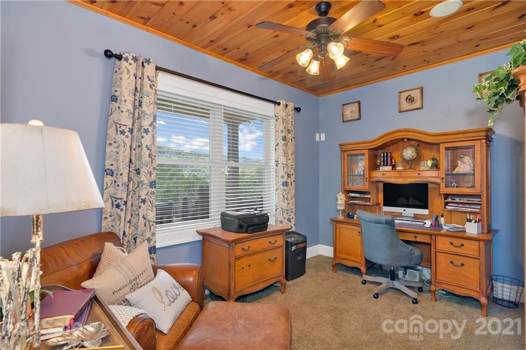 253 Benitez Way Clyde, NC 28721 - Photo 8 of 40 a view of a livingroom with workspace and a window