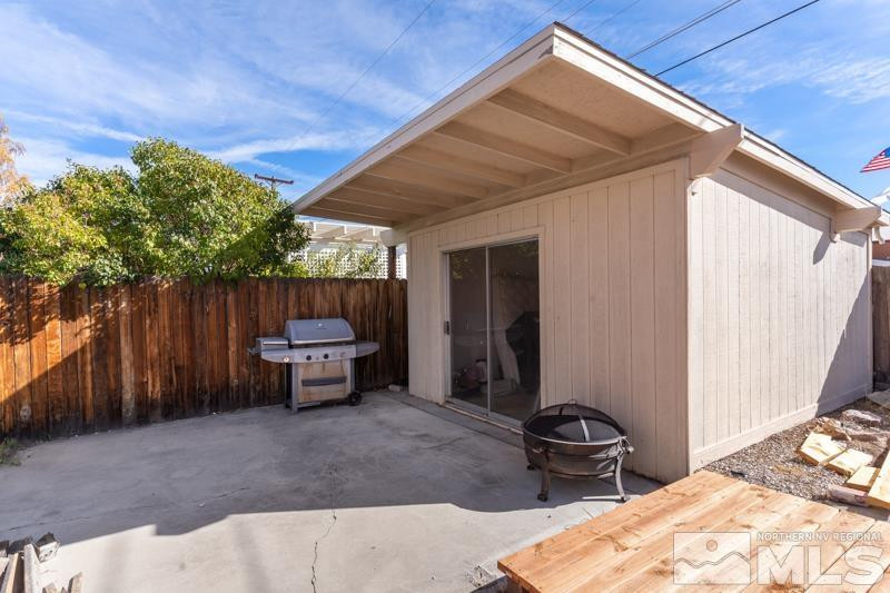 613 Ivy Street Carson City, NV 89703 - Photo 24 of 25 a backyard of a house with yard and outdoor seating