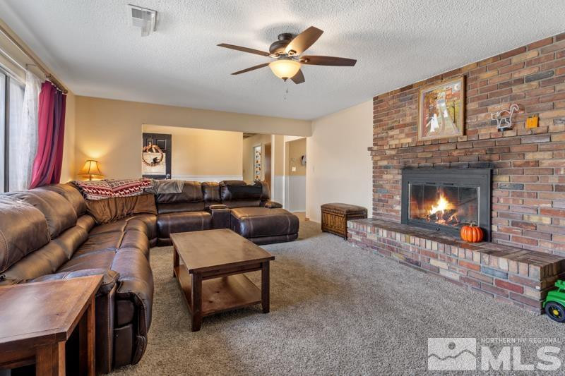 613 Ivy Street Carson City, NV 89703 - Photo 5 of 25 a living room with furniture and a fireplace