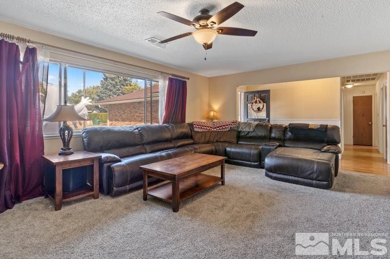 613 Ivy Street Carson City, NV 89703 - Photo 6 of 25 a living room with furniture and a large window