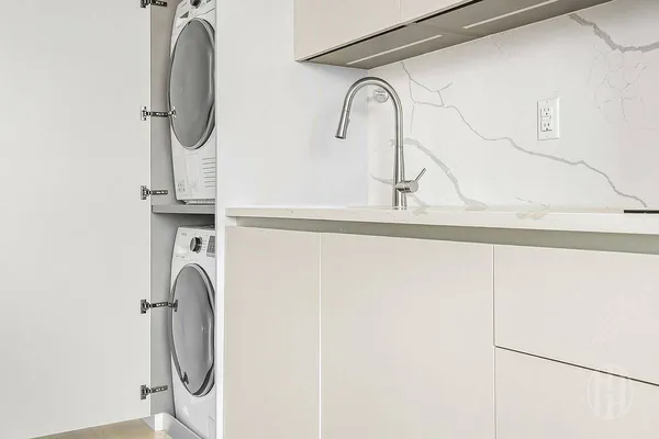 a kitchen with stainless steel appliances a stove and a microwave