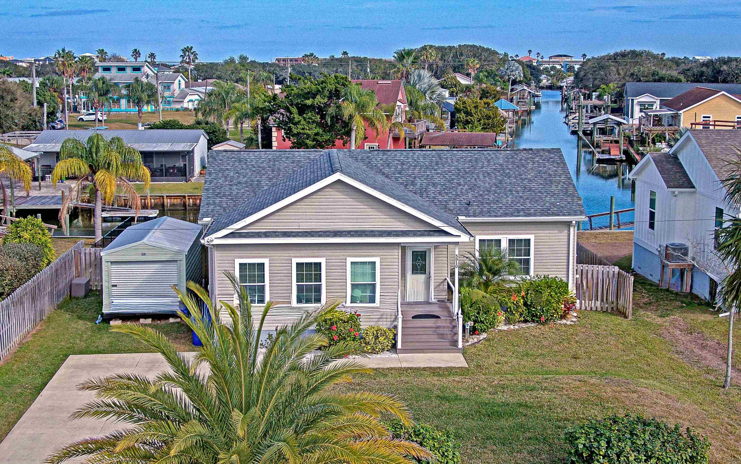 5910 Rio Royalle Road St. Augustine, FL 32080 - Photo 1 of 48 an aerial view of a house with a yard table and chairs