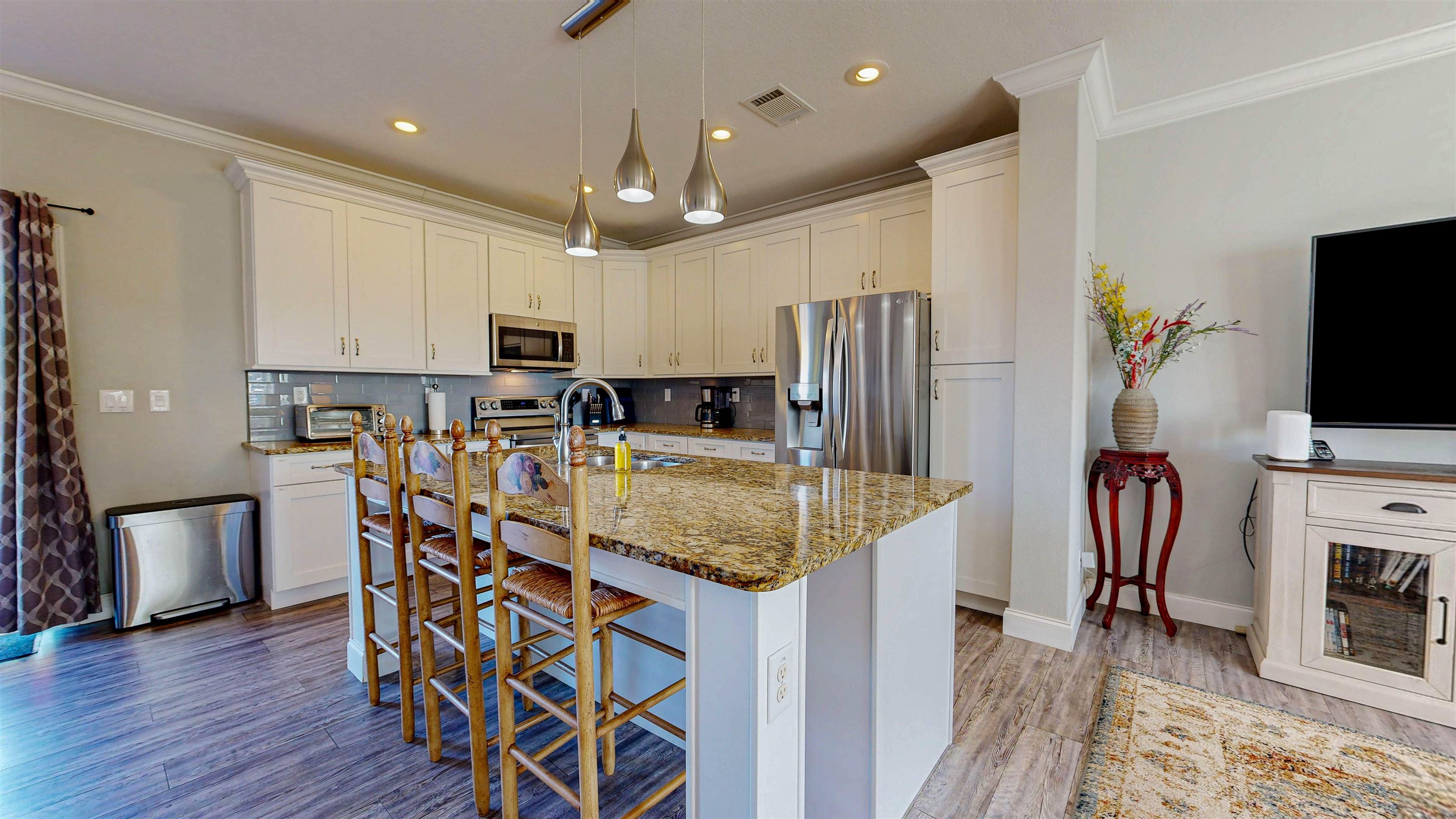 5910 Rio Royalle Road St. Augustine, FL 32080 - Photo 13 of 48 a kitchen with stainless steel appliances granite countertop a refrigerator oven a sink dishwasher and wooden cabinets with wooden floor