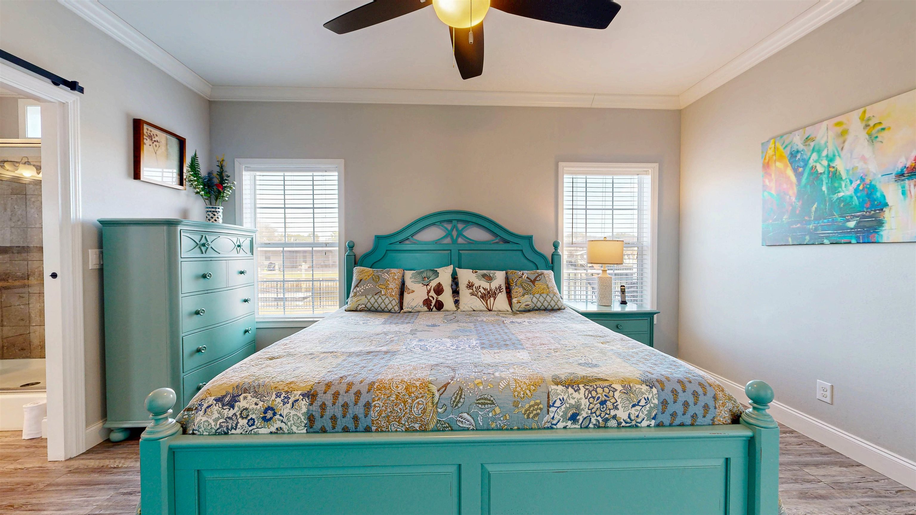 5910 Rio Royalle Road St. Augustine, FL 32080 - Photo 22 of 48 a bedroom with a bed and a painting on the wall