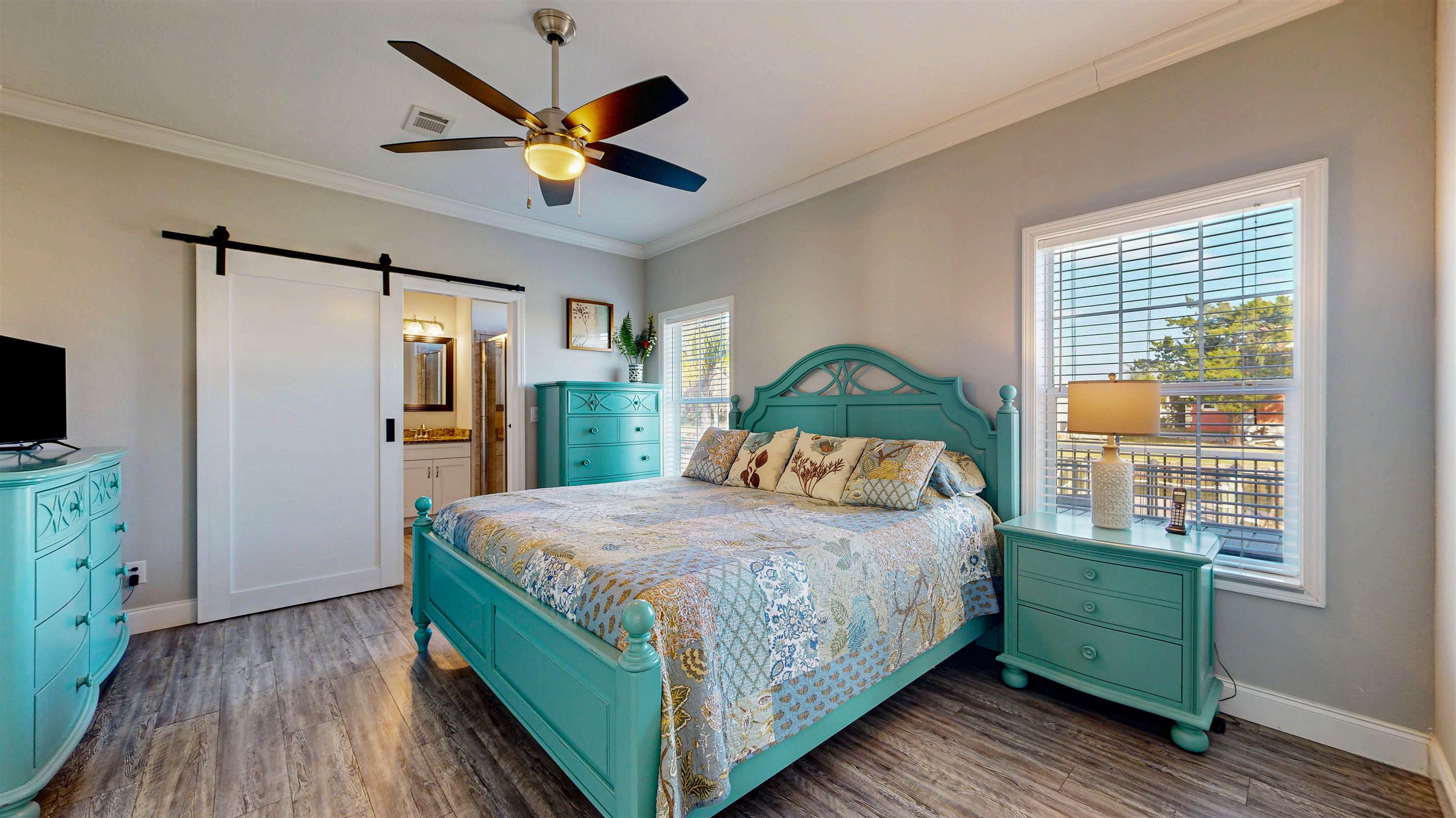 5910 Rio Royalle Road St. Augustine, FL 32080 - Photo 23 of 48 a bedroom with a bed and a large window