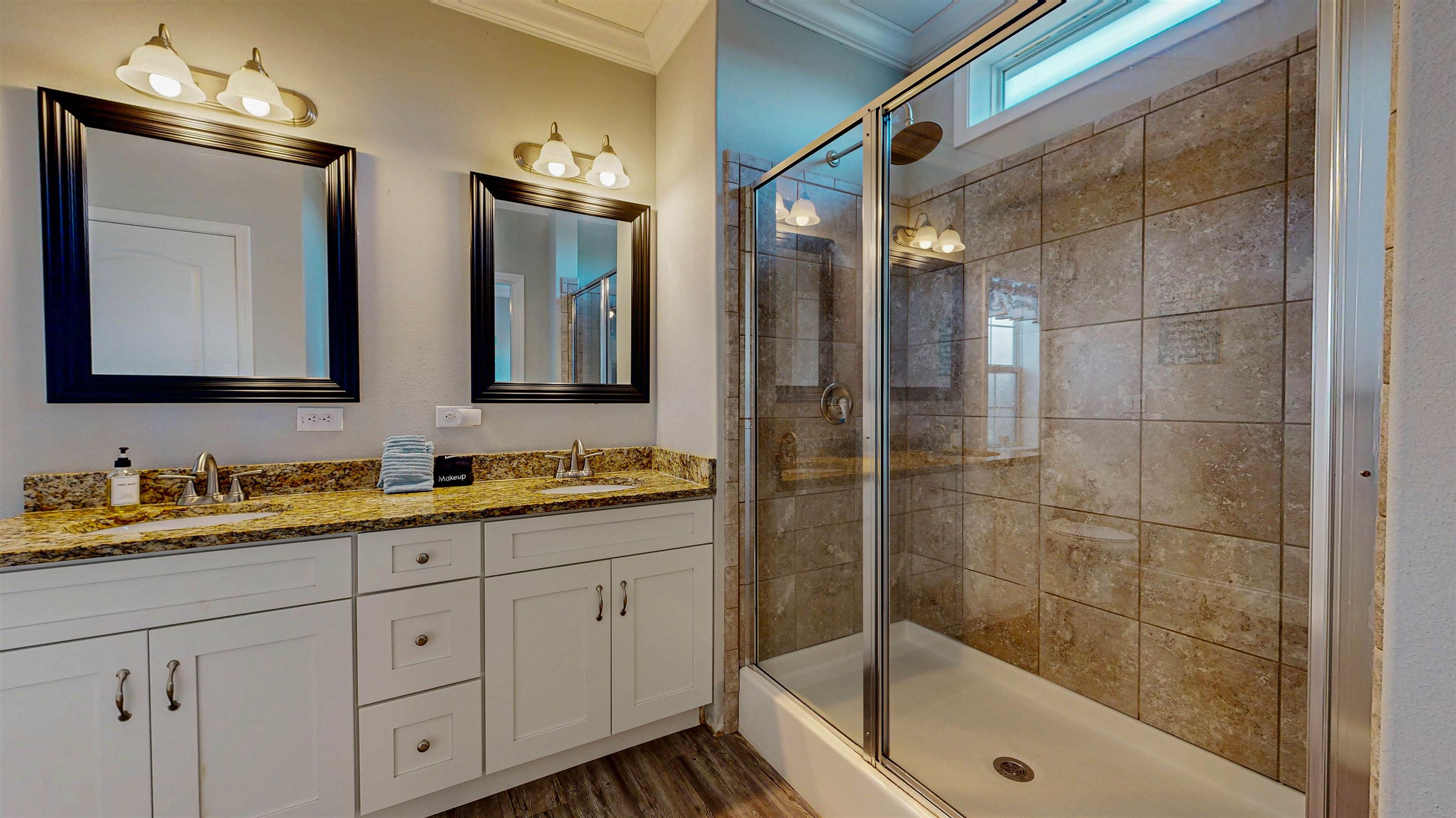5910 Rio Royalle Road St. Augustine, FL 32080 - Photo 28 of 48 a bathroom with a double vanity sink mirror and shower
