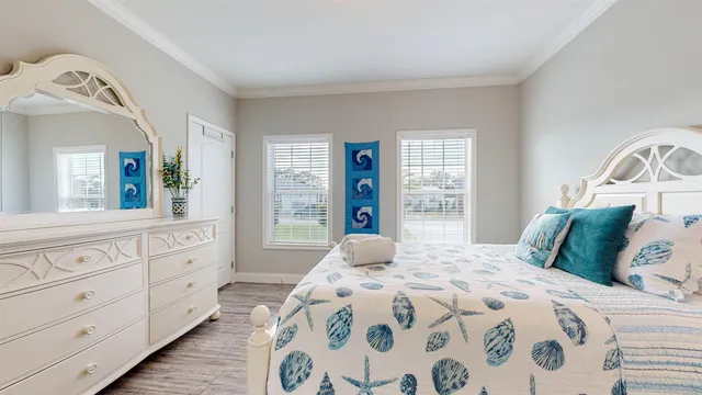 a bedroom with a large bed and a window