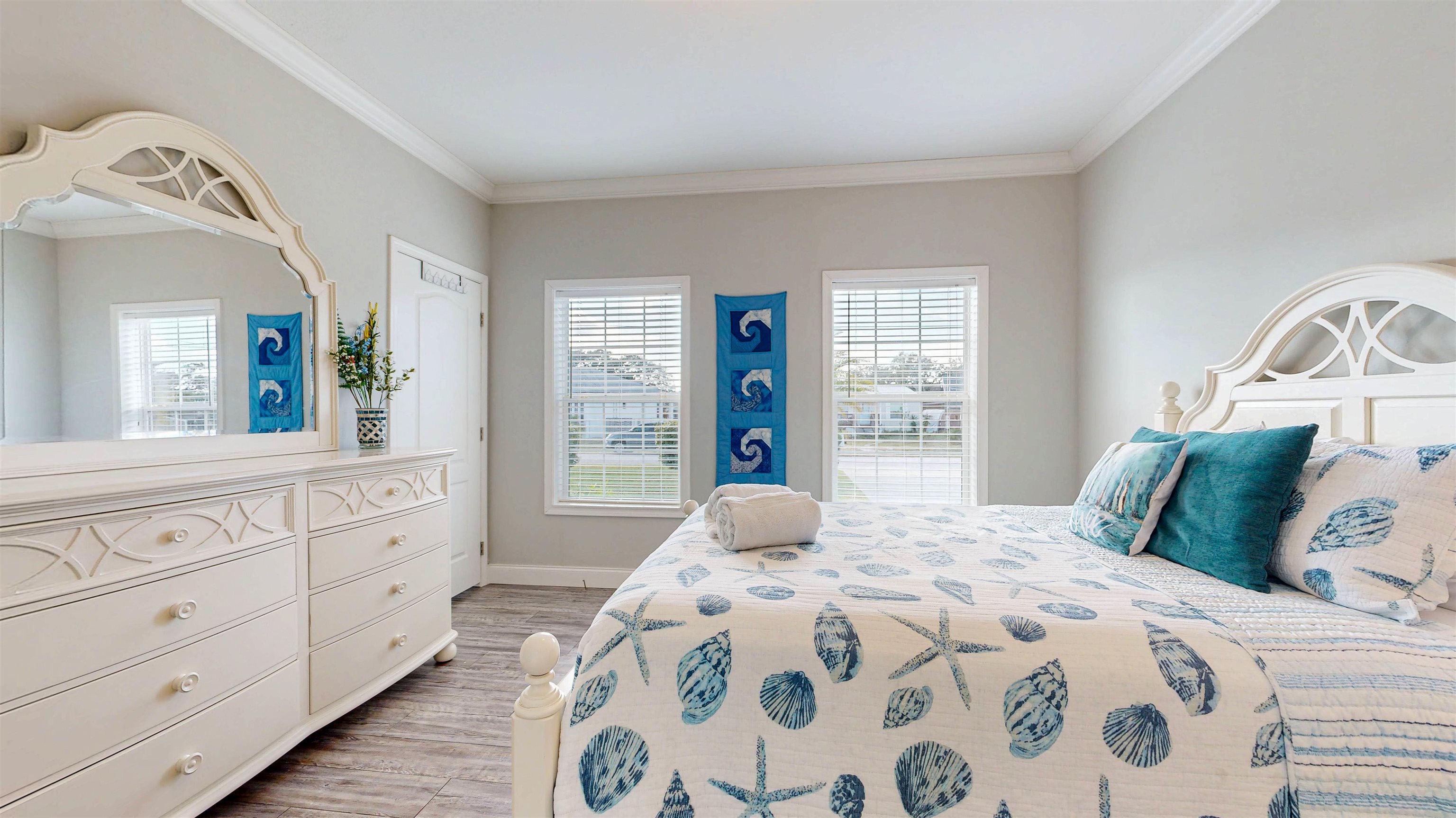 5910 Rio Royalle Road St. Augustine, FL 32080 - Photo 31 of 48 a bedroom with a large bed and a window