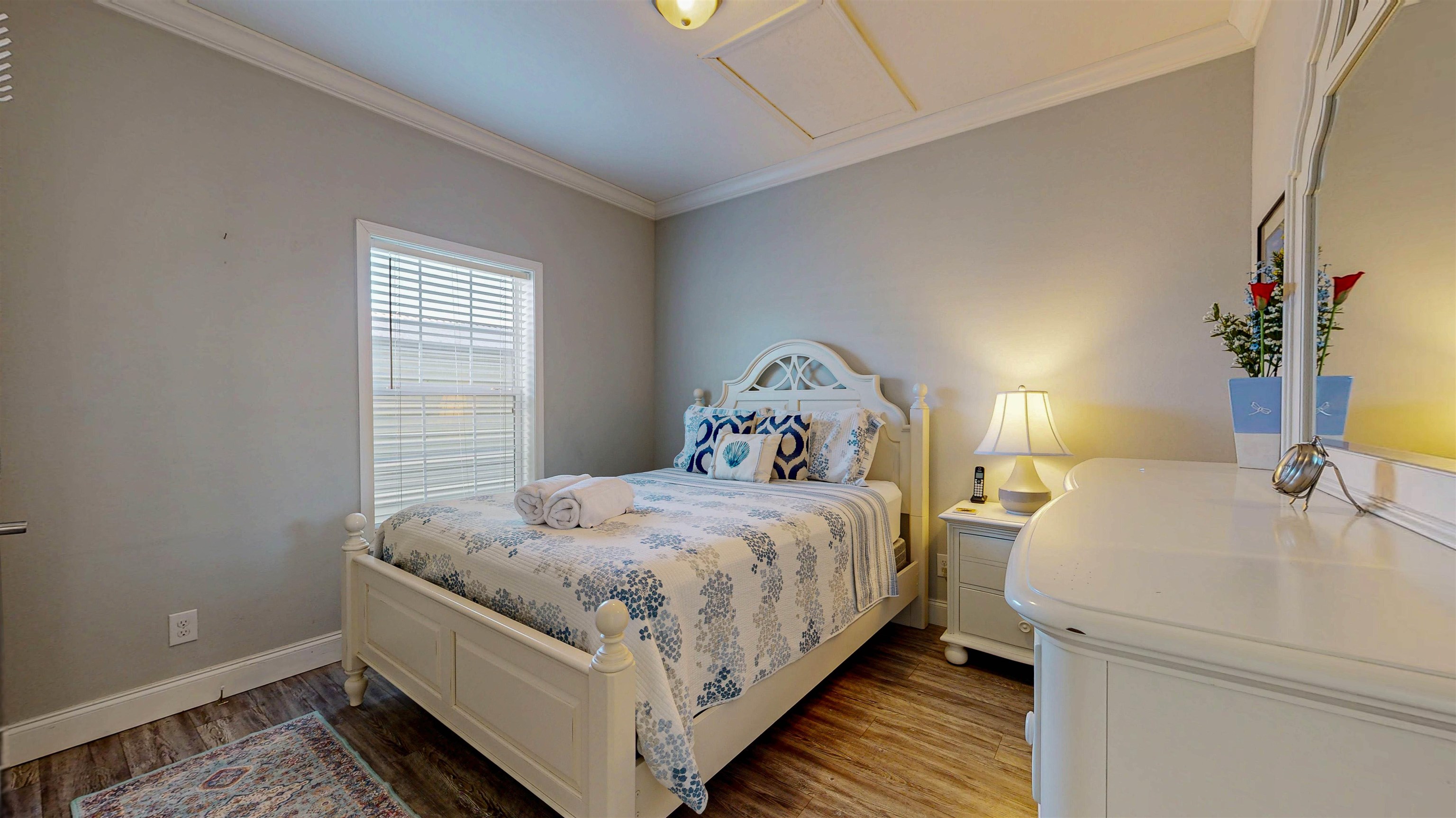 5910 Rio Royalle Road St. Augustine, FL 32080 - Photo 34 of 48 a bedroom with a bed and wooden floor