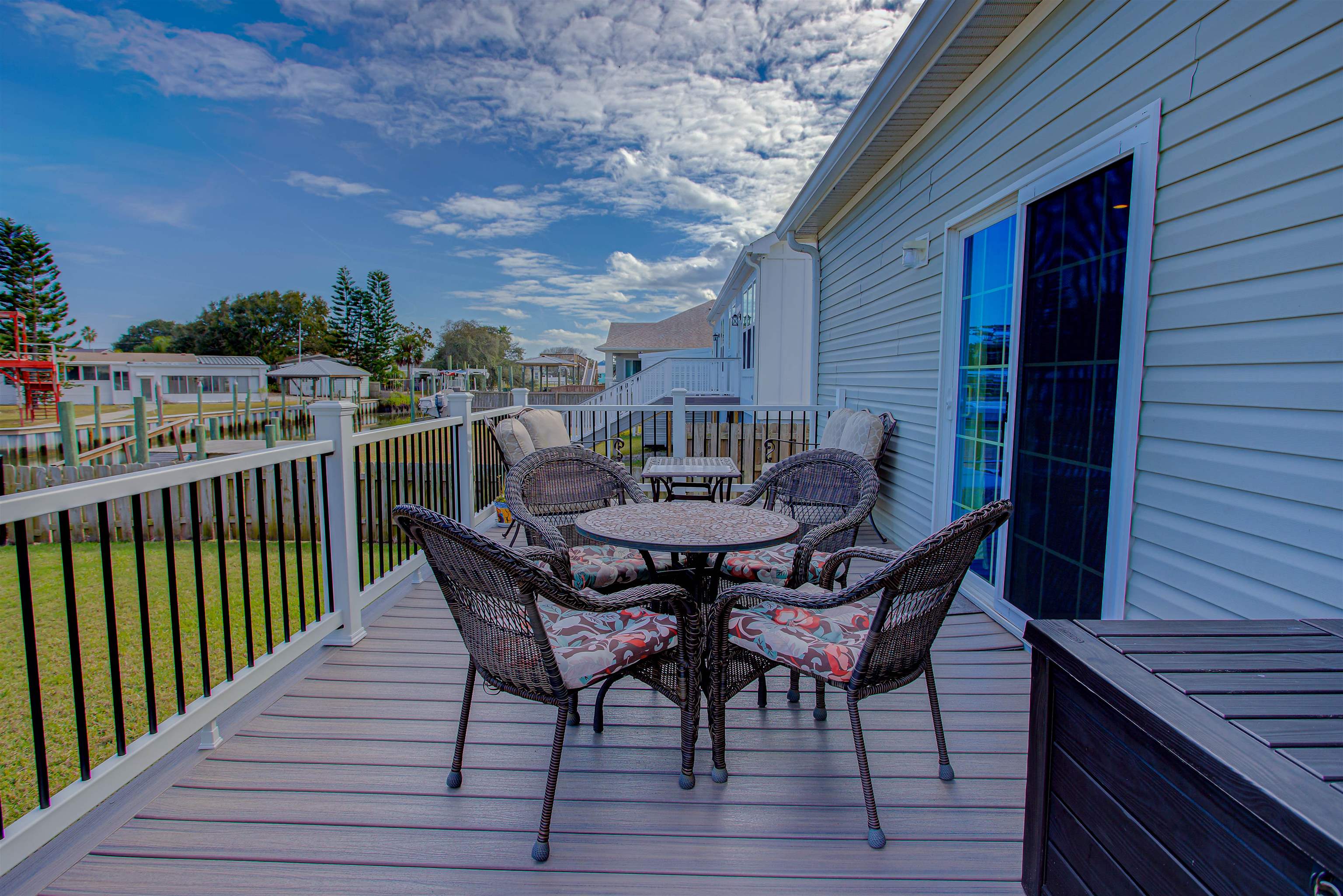 5910 Rio Royalle Road St. Augustine, FL 32080 - Photo 37 of 48 a view of a chairs and table on the deck