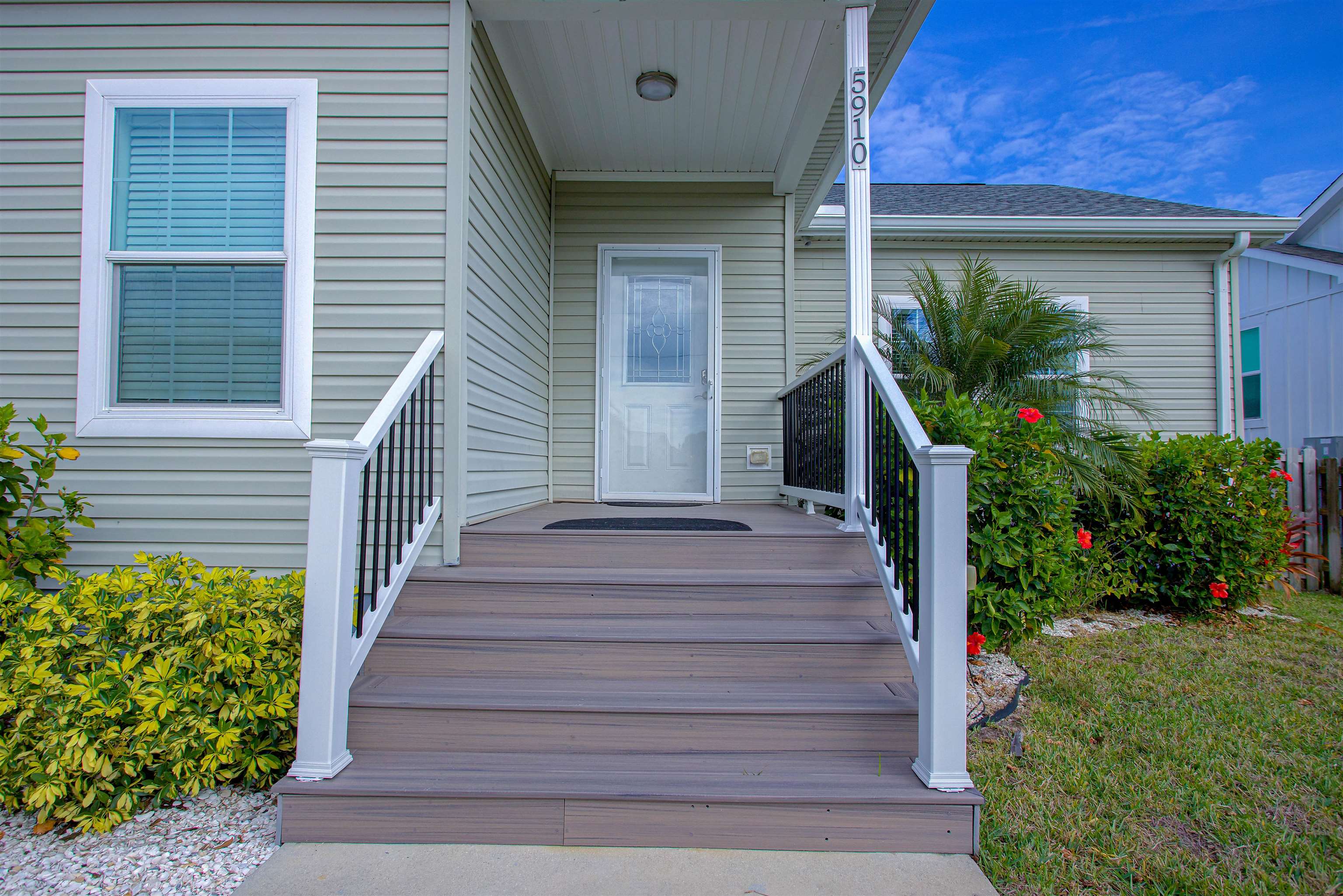 5910 Rio Royalle Road St. Augustine, FL 32080 - Photo 7 of 48 a front view of a house with a garden