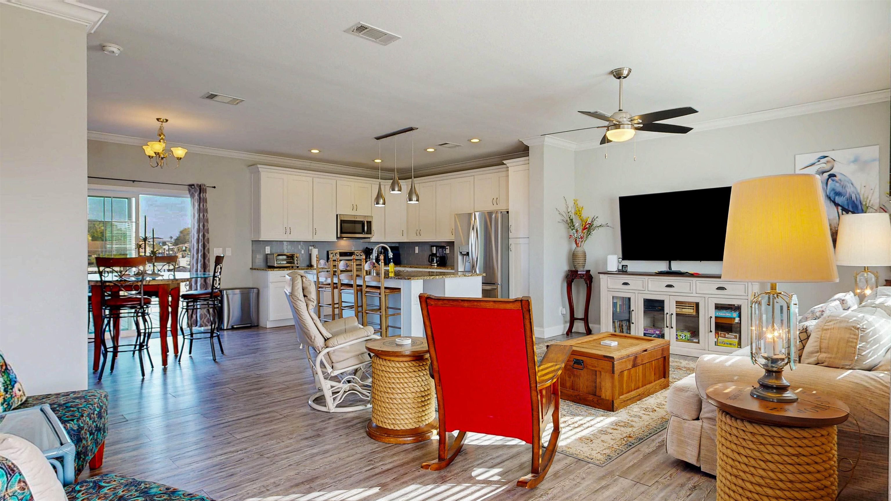 5910 Rio Royalle Road St. Augustine, FL 32080 - Photo 9 of 48 a living room with furniture kitchen view and a flat screen tv