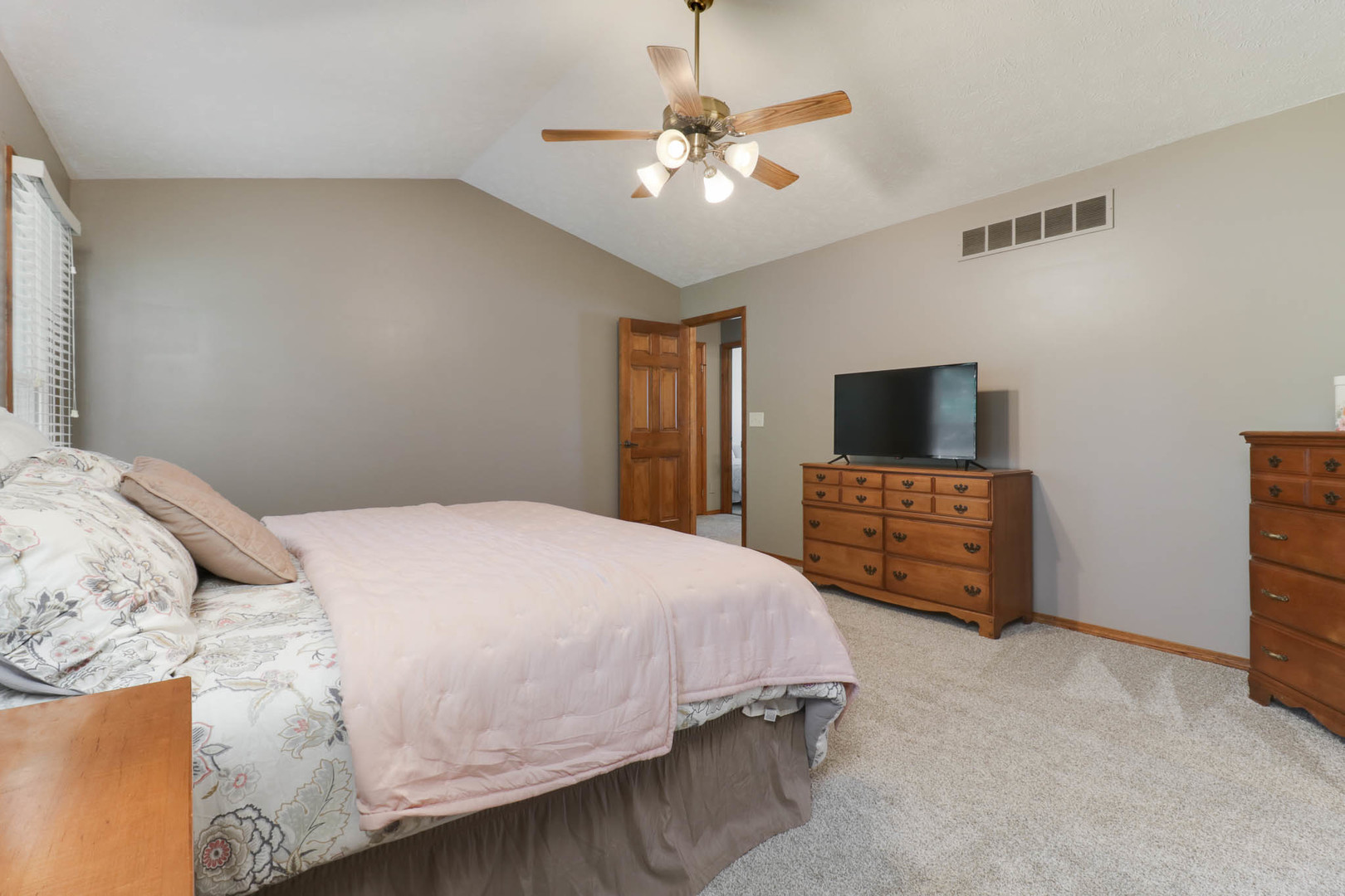 3203 Eagle Crest Road Bloomington, IL 61704 - Photo 20 of 52 a bedroom with a bed and a flat screen tv