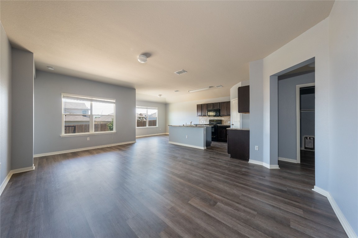 414 Pentire Way Hutto, TX 78634 - Photo 11 of 26 a view of empty room with kitchen and window