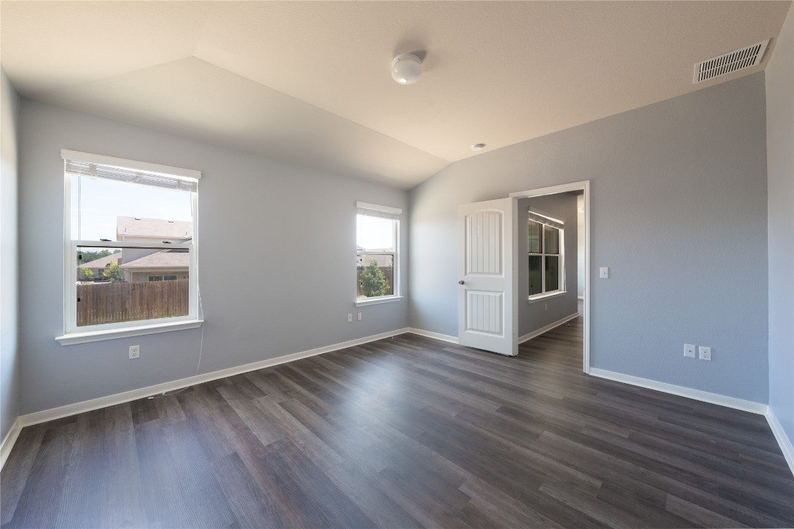 414 Pentire Way Hutto, TX 78634 - Photo 15 of 26 an empty room with wooden floor and windows