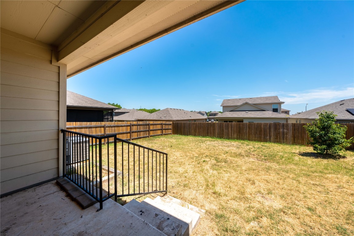 414 Pentire Way Hutto, TX 78634 - Photo 21 of 26 a view of a swimming pool with a lounge chair