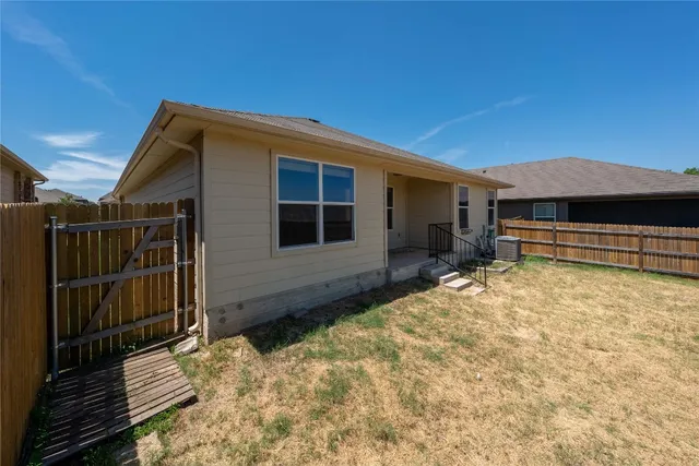 a house view with a backyard space