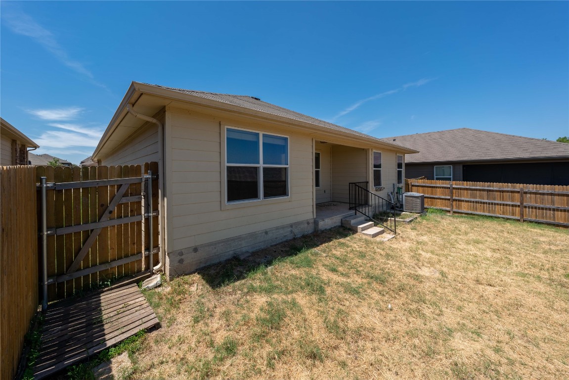 414 Pentire Way Hutto, TX 78634 - Photo 23 of 26 a house view with a backyard space