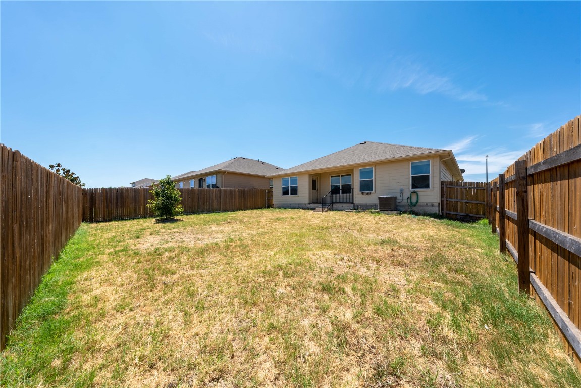 414 Pentire Way Hutto, TX 78634 - Photo 25 of 26 a front view of a house with a yard