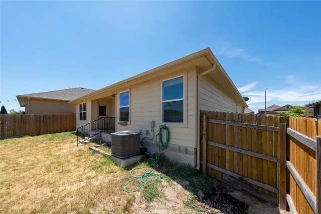 a backyard of a house with seating space