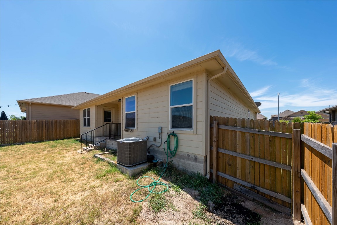 414 Pentire Way Hutto, TX 78634 - Photo 26 of 26 a backyard of a house with seating space