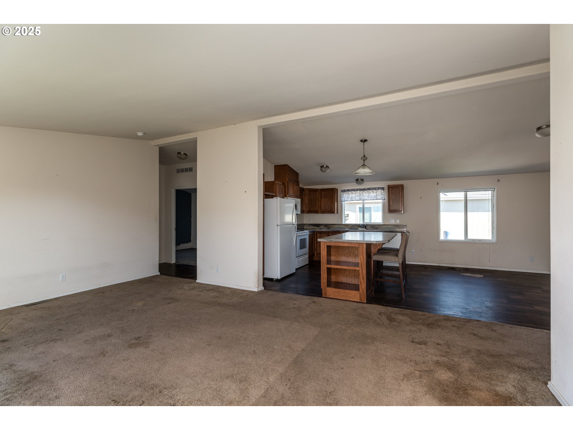 2154 Oregon Street, Unit 25 St. Helens, OR 97051 - Photo 3 of 11 a kitchen with refrigerator and cabinets