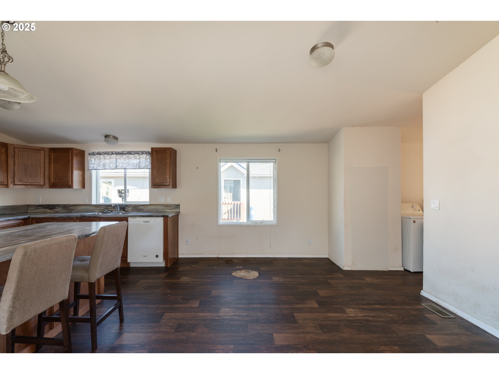 2154 Oregon Street, Unit 25 St. Helens, OR 97051 - Photo 5 of 11 a view of kitchen with livingroom and wooden floor
