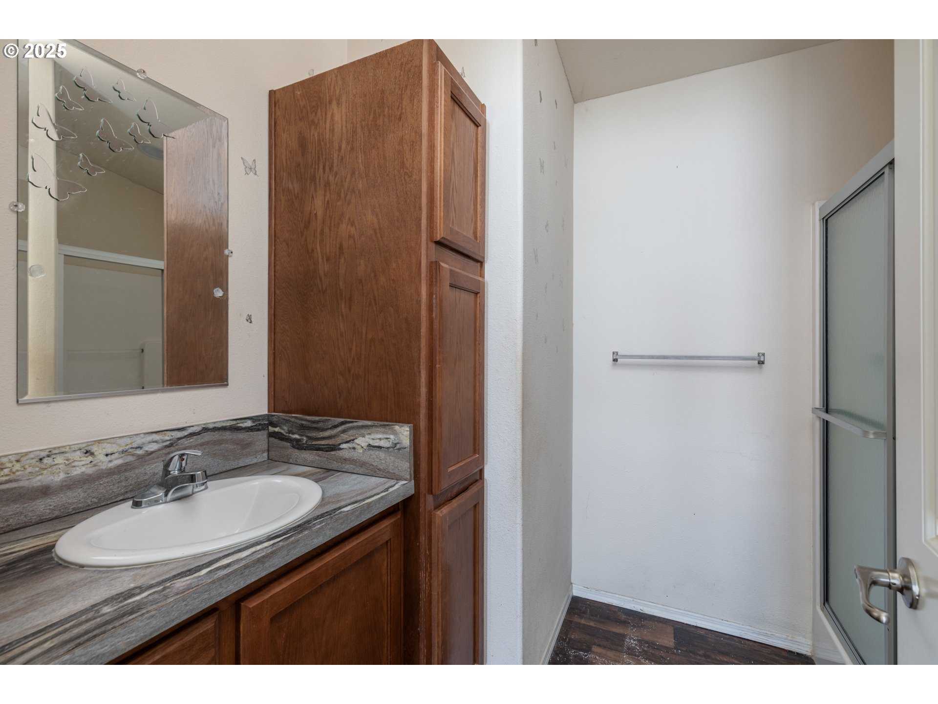 2154 Oregon Street, Unit 25 St. Helens, OR 97051 - Photo 8 of 11 a bathroom with a granite countertop sink and a mirror