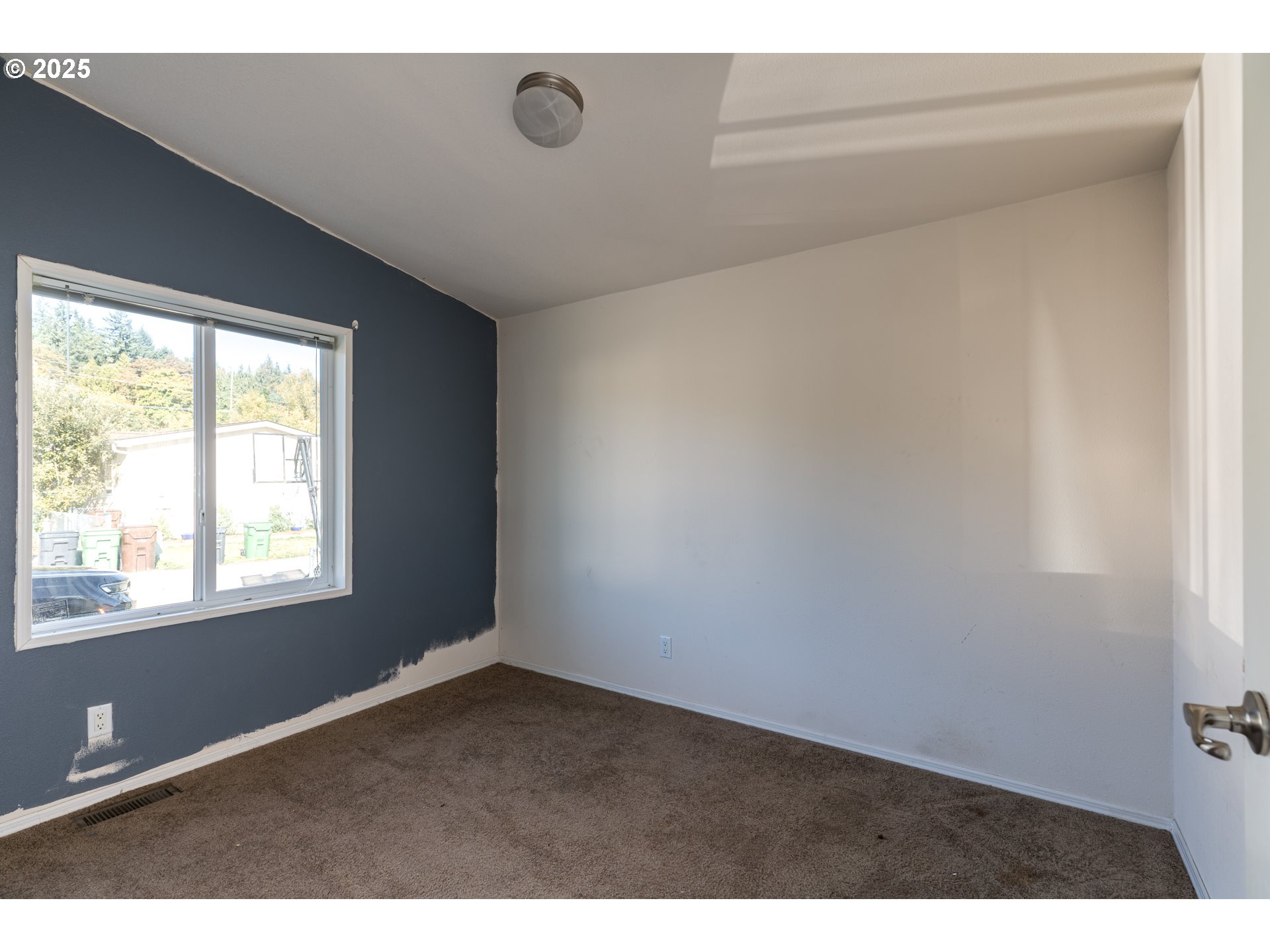 2154 Oregon Street, Unit 25 St. Helens, OR 97051 - Photo 9 of 11 a view of an empty room with a window