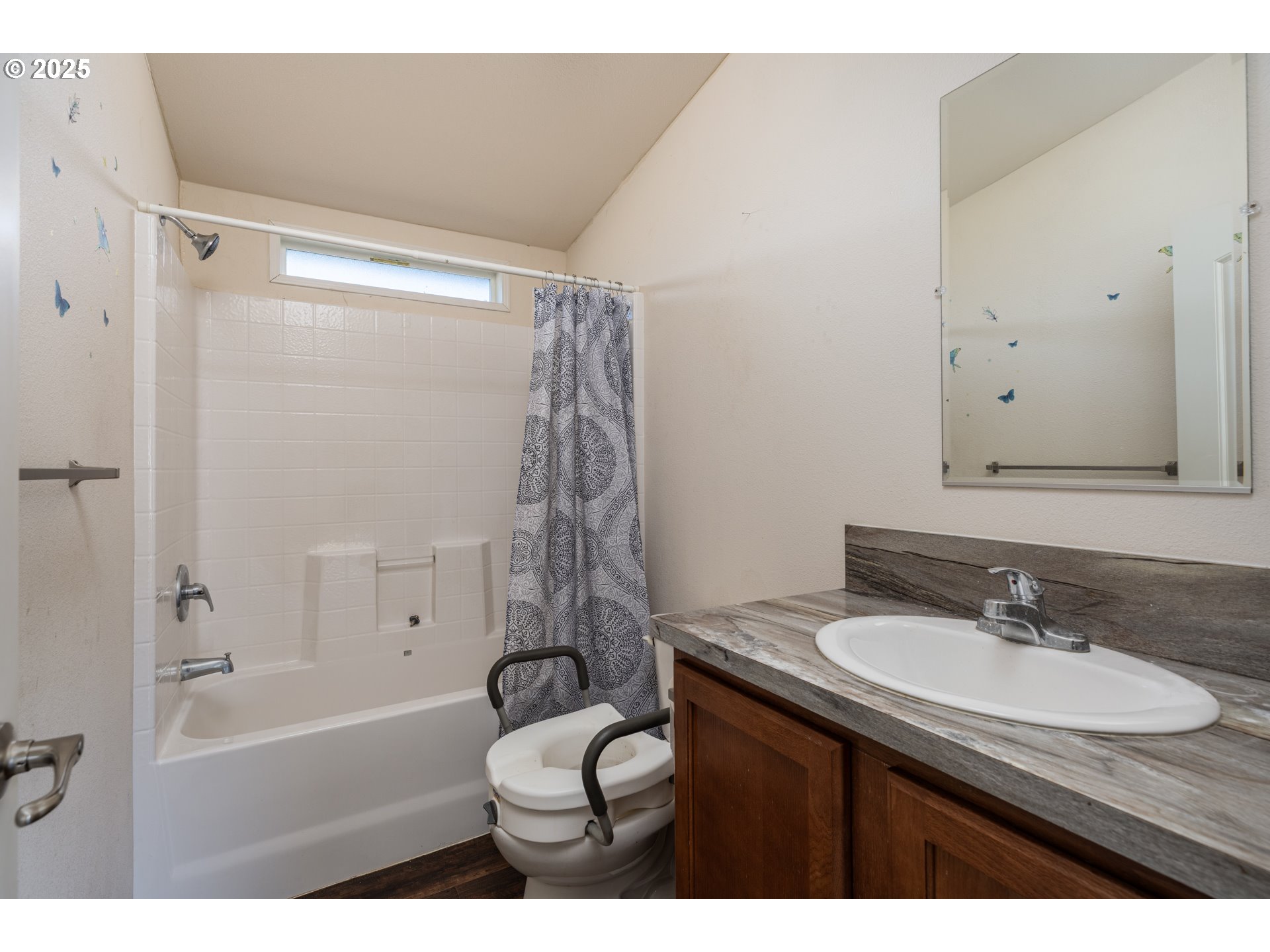 2154 Oregon Street, Unit 25 St. Helens, OR 97051 - Photo 10 of 11 a bathroom with a sink toilet a mirror and shower