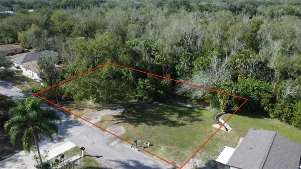 an aerial view of residential house with outdoor space