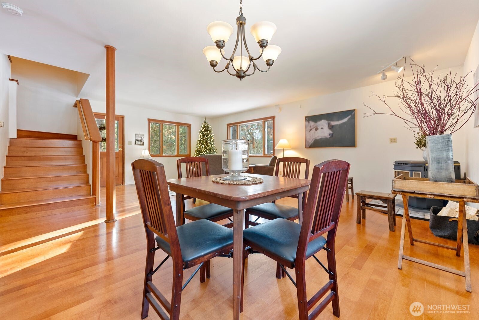 5 Chase Road Winthrop, WA 98862 - Photo 23 of 40 a view of a dining room with furniture a chandelier and wooden floor