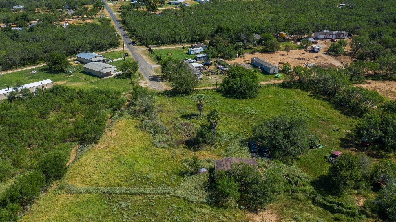 345 Pinn Road Lytle, TX 78052 - Photo 6 of 11 an aerial view of residential house with outdoor space and trees all around