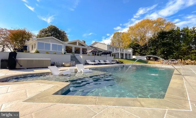 a kitchen with sink stove and cabinets