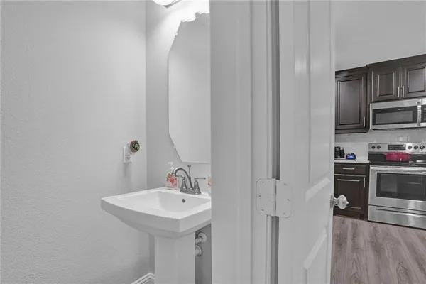 a bathroom with a sink and a mirror