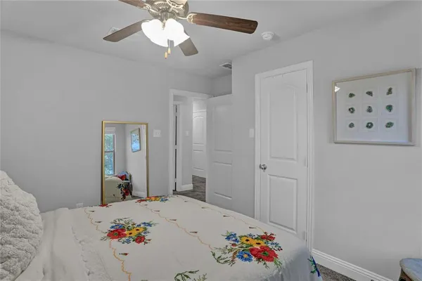 a bed room with a bed and a chandelier