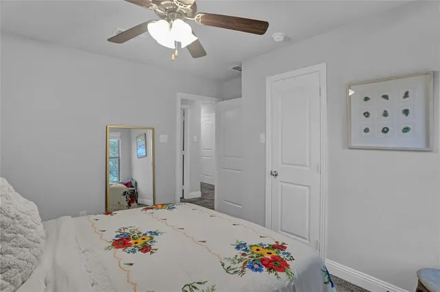 a bed room with a bed and a chandelier