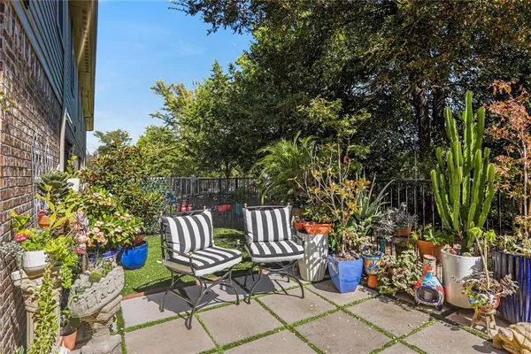 a view of a chairs and table in backyard