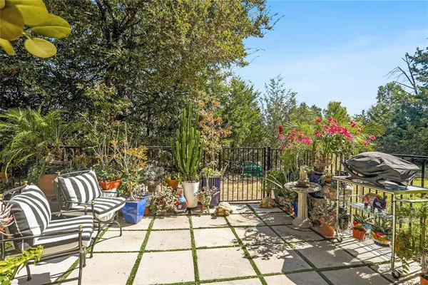 a view of a chairs and table in the patio