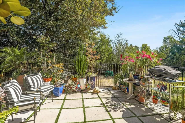 a view of a chairs and table in the patio
