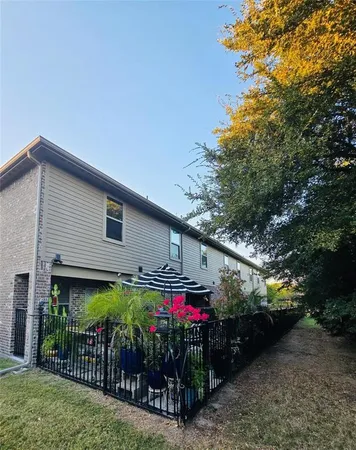 a front view of house along with trees