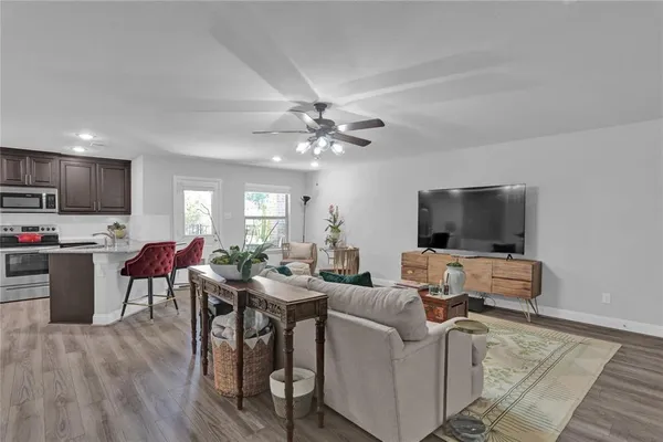 a living room with furniture and a flat screen tv