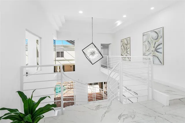 a view of a livingroom with furniture and a potted plant