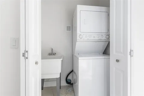 a front view of a house with swimming pool and a patio