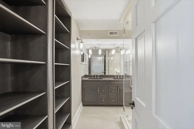 a kitchen with stainless steel appliances a stove and a refrigerator