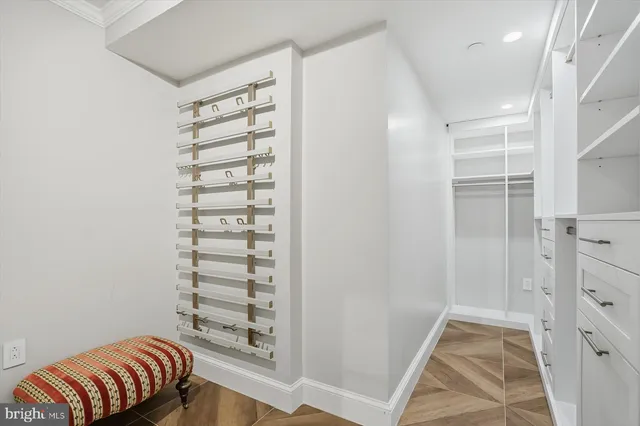 a view of room with walk in closet and window